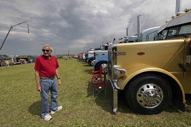 Gary Tarvestar of Rochelle looks over the vast number of big rigs Saturday, August 5, 2023 in Franklin Grove. The trucks were part of the Harvest Fest at Chaplin Creek Historic Village that also featured demonstrations of  blacksmithing and of life in pioneering days.