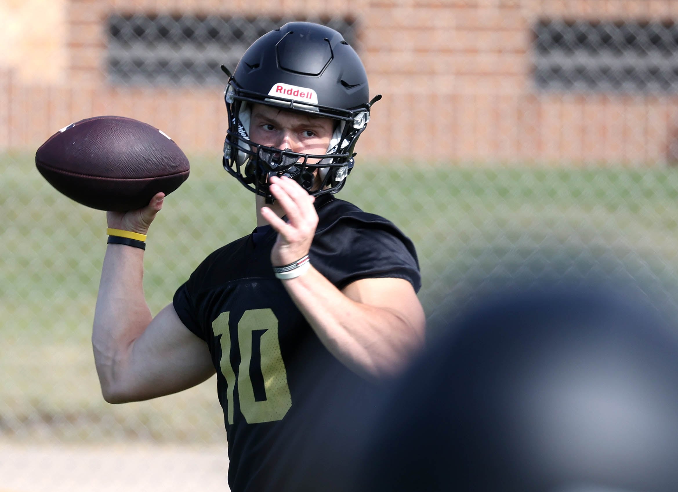 Sycamore quarterback Burke Gautcher throws a pass Monday, Aug. 12, 2024, during the first practice of the regular season.