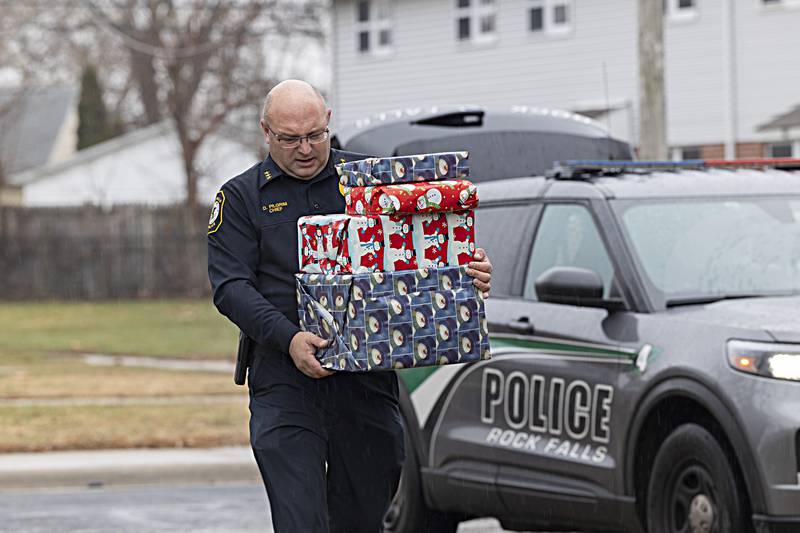 Rock Falls police chief Dave Pilgrim makes a delivery of gifts Friday, Dec. 22, 2023 as part of the department’s Operation Santa Claus. Six families and 21 kids received gifts as part of the program.