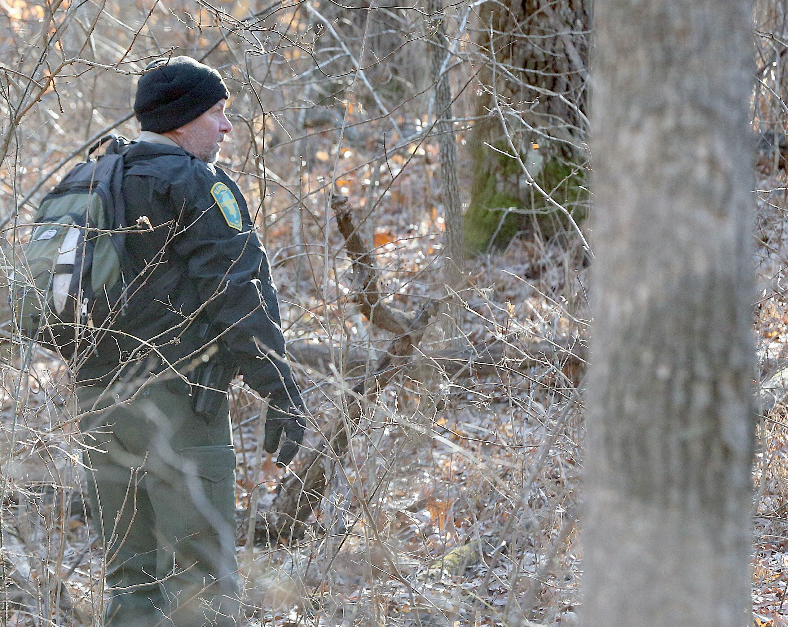 Conservation Police officer Joe Kaufman, leads a ground search near French Canyon on Friday, Jan. 17, 2020, at Starved Rock State Park. Conservation Police along with Utica and Oglesby fire departments were conducting the ground search to find Tina Donovon, a missing woman from Ottawa. 