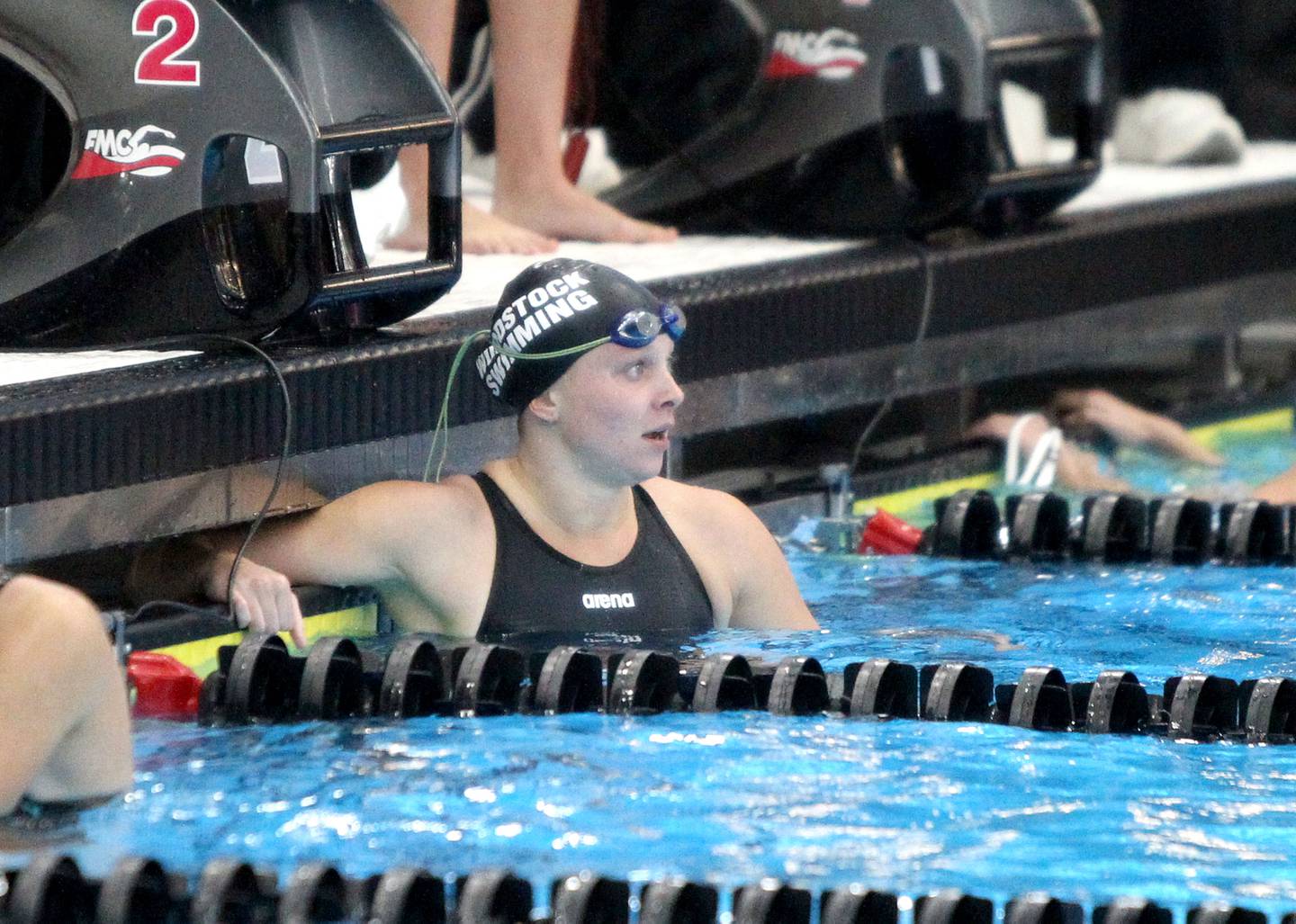 Woodstock North's Hannah Blaksley (center) completes the 50-yard freestyle during the IHSA State Swimming Championship preliminaries at FMC Natatorium in Westmont on Friday, Nov. 12, 2021.