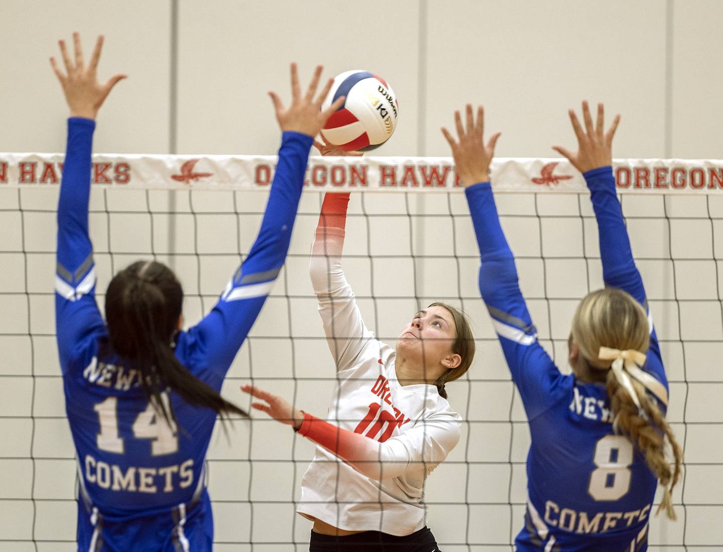 Oregon’s Lola Schwarz makes a hit against Newman Thursday, Sept. 12, 2024, at the Blackhawk Center in Oregon.