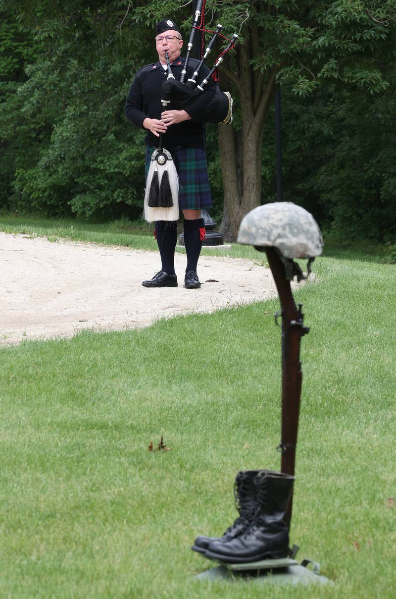A member of the Firefighter Highland Guard of DeKalb plays “Amazing Grace” on the bagpipes Monday, May 27, 2024, during the DeKalb Memorial Day program at Ellwood House.