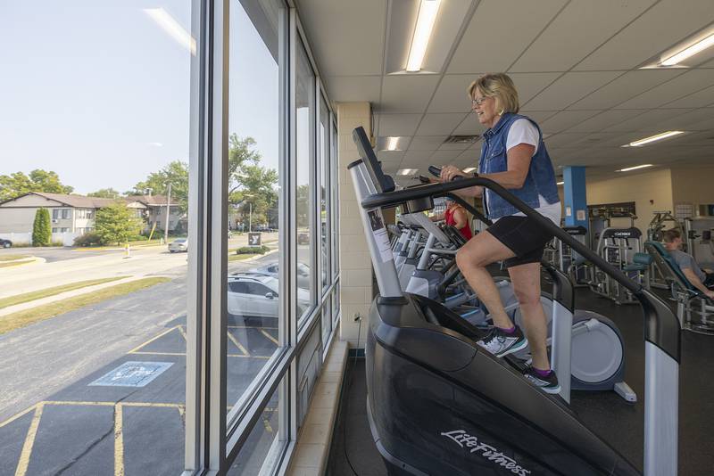 Cheryl Sohn of Dixon uses a stair climbing machine Wednesday, Sept. 11, 2024, at the Dixon YMCA. The Y put forth a challenge to patrons to use the machine to climb 110 flights, the same at the World Trade Center, in recognition of 9/11.