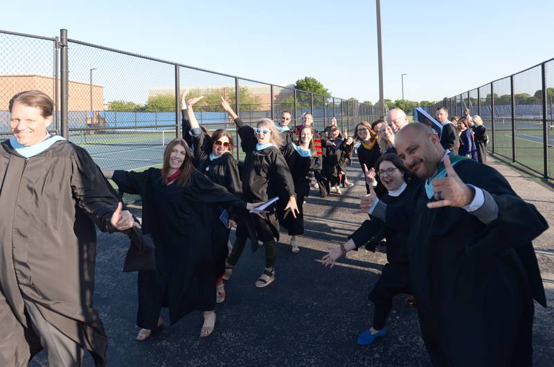 Lyons Township faculty take a fun group photo during the graduation ceremony Wednesday May 29, 2024.