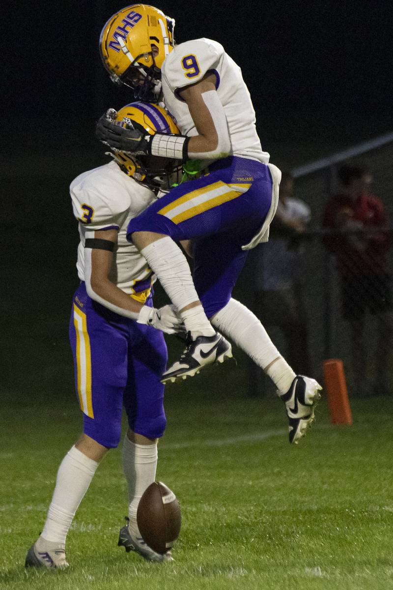 Mendota's Gavin Evans celebrates a touchdown by Rhett Watson during the game against Hall High School at Richard Nesti Stadium on September 13, 2024.