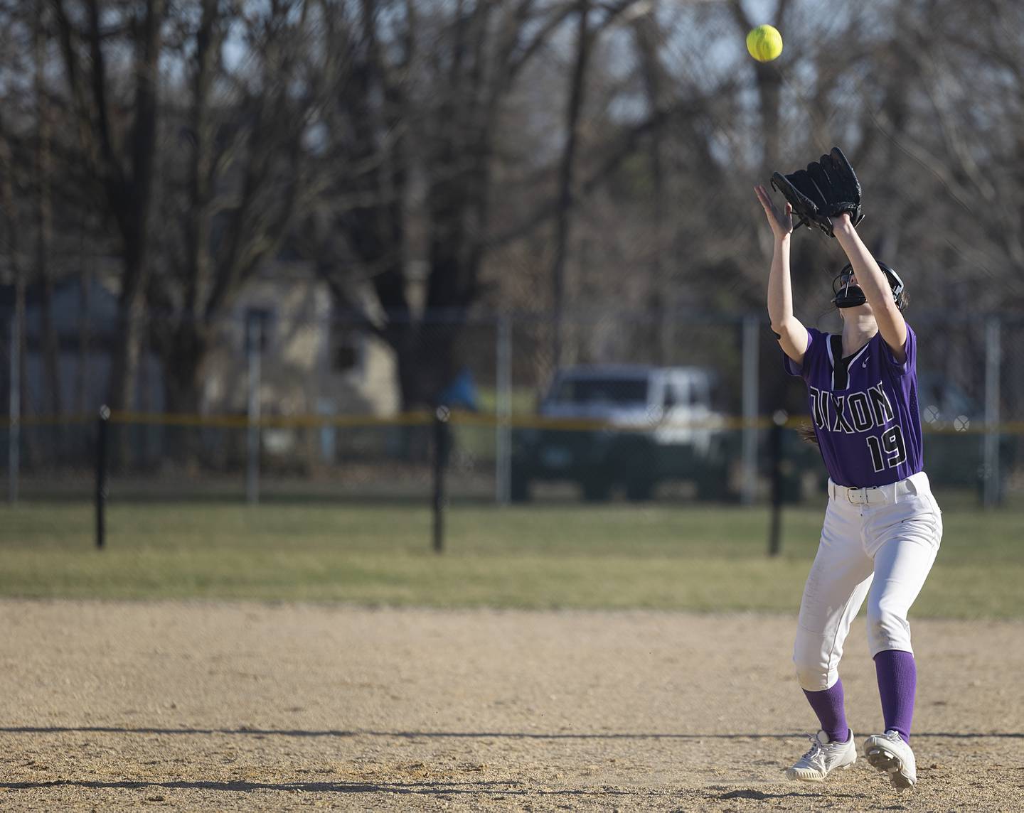 Dixon’s Taylor Frost camps under a pop fly for an out against Sterling Tuesday, March 19, 2024 in Dixon.