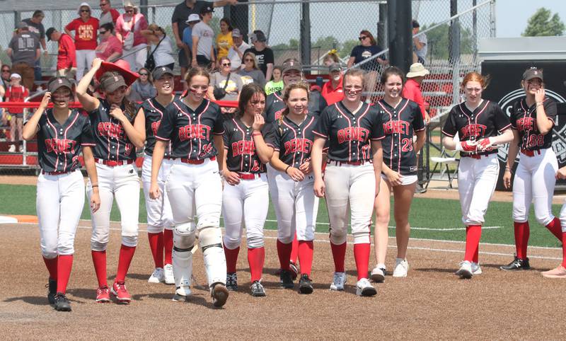 Members of the Benet Academy softball team smile while walking off the field after winning the Class 3A State third place game over Charleston on Saturday, June 10, 2023 at the Louisville Slugger Sports Complex in Peoria.