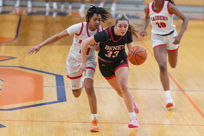 Benet’s Magdalena Sularski (33) brings the ball up the court against Bolingbrook's Persais Williams (21) during a Oswego semifinal sectional 4A basketball game at Oswego High School on Tuesday, Feb 20, 2024.