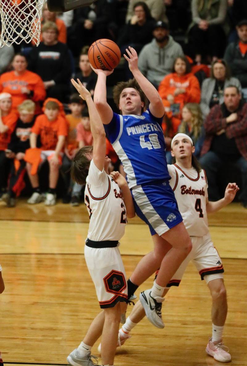 Princeton junior Jordan Reinhardt shoots for two in Tuesday's game at Kewanee. The Tigers fell in overtime 64-59.