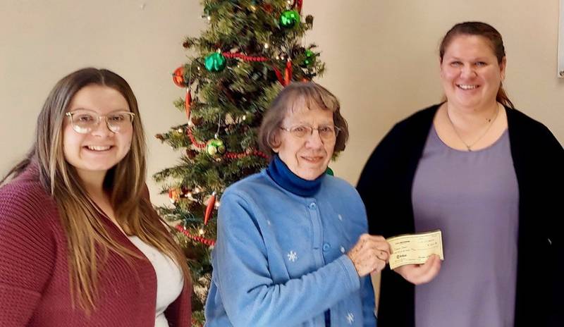 Pictured from left are Kayla Suarez, P.E.O. member Joan Hardekopf and Rebecca Hoelker.