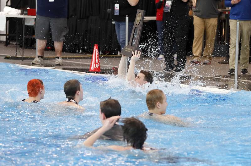 Hinsdale Central celebrates after winning the IHSA Boys state swim finals Saturday February 25, 2023 in Westmont.