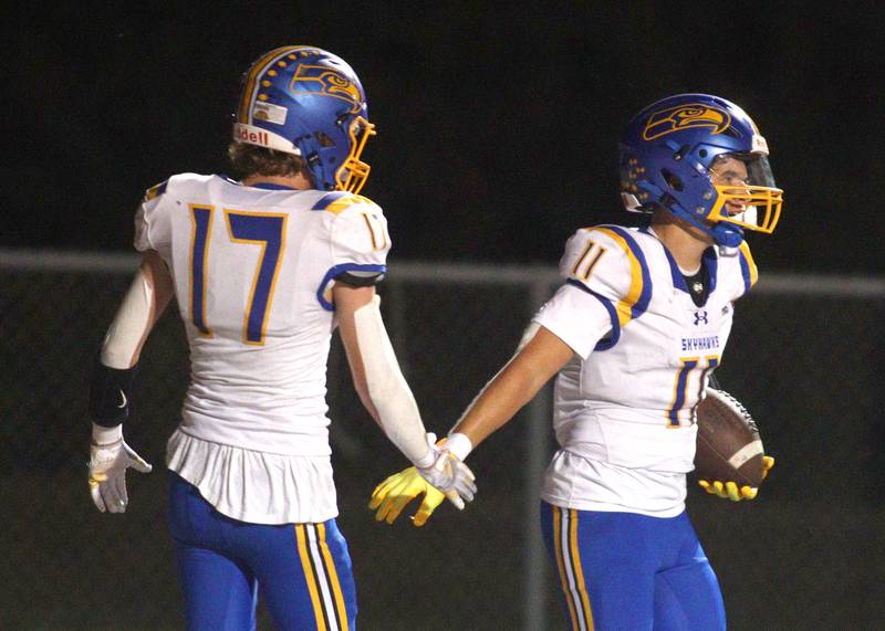 Johnsburg’s Ryan Franze, right, is greeted after scoring a touchdown in varsity football action on Friday, Sept. 13, 2024, at Richmond-Burton High School in Richmond.