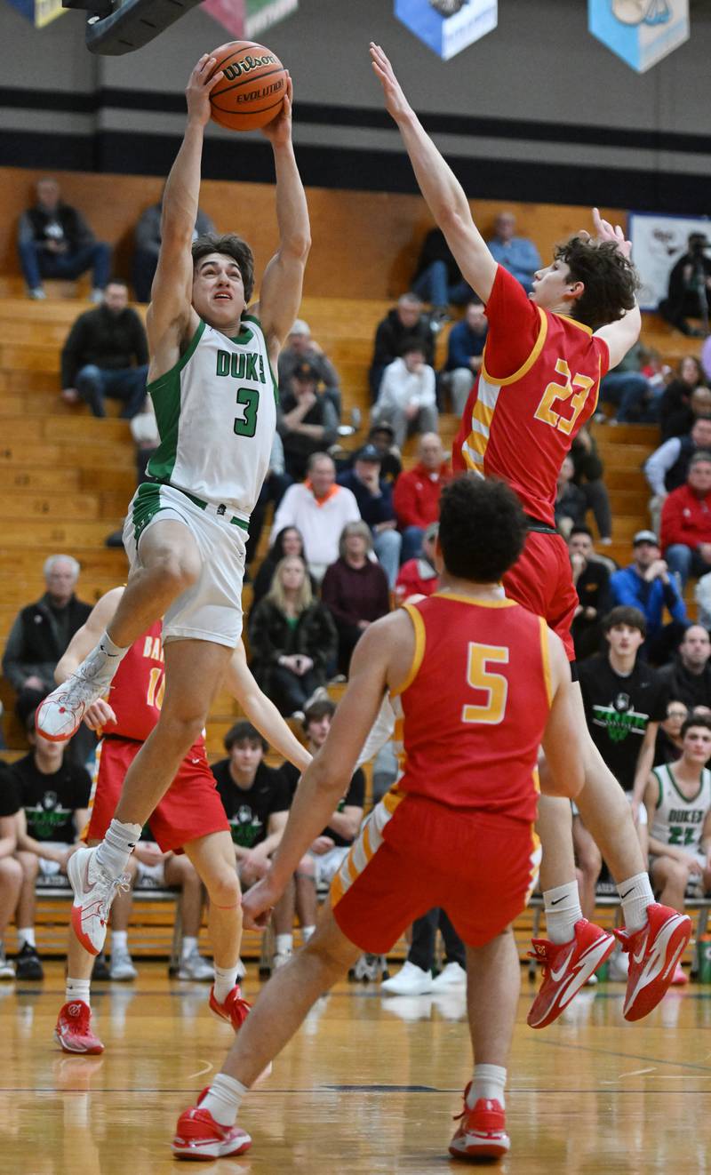 York’s A.J. Levine, left, goes to the basket as Batavia’s Jax Abalos defends during the Addison Trail Class 4A boys basketball sectional semifinal on Wednesday, Feb. 28, 2024 in Addison.