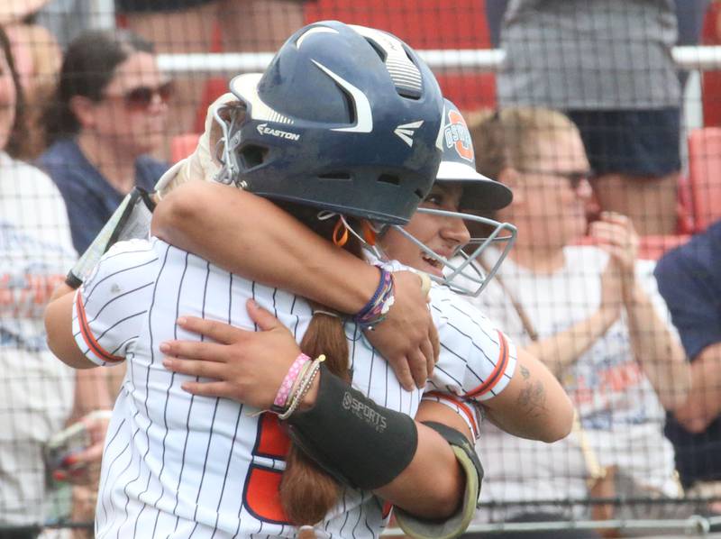 Oswego's Marissa Moffett and Kiyah Chavez react after scoring runs against Mundelein during the Class 4A third place game on Saturday, June 8, 2024 at the Louisville Slugger Sports Complex in Peoria.