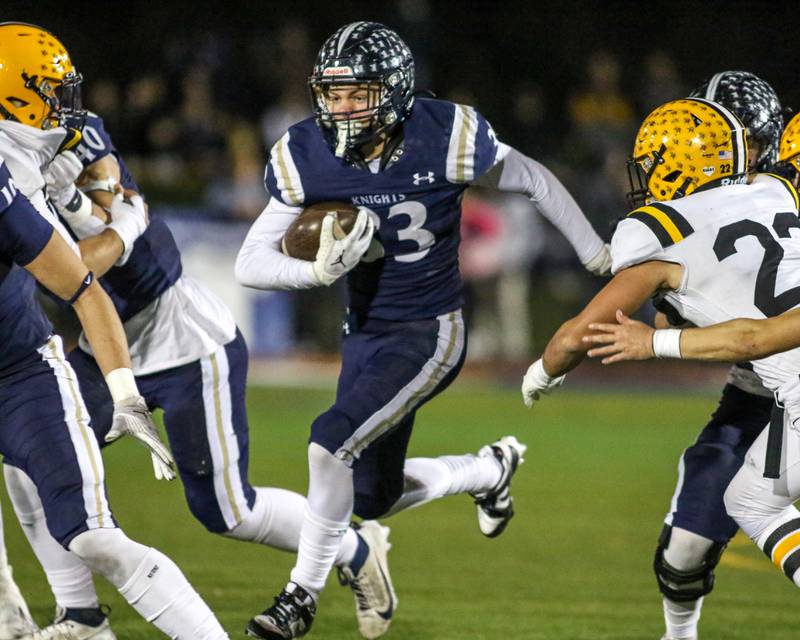 IC Catholic Prep's Joey Gliatta (33) runs up the middle during Class 4A third round playoff football game between St Laurence at IC Catholic Prep.  Nov 11, 2023.