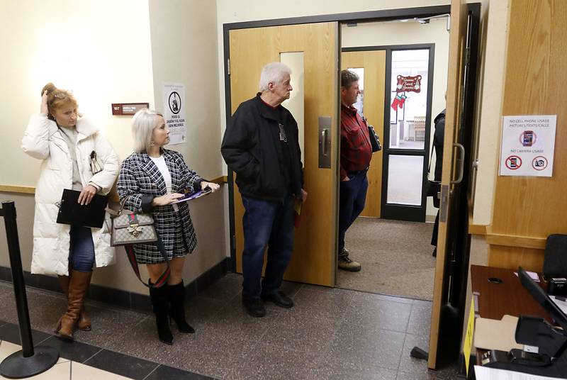 Candidates wait to file their candidate forms on Monday, Nov. 27, 2023, at the McHenry County Clerk's Office. Monday was the first day for candidates to file ahead of the March primaries.