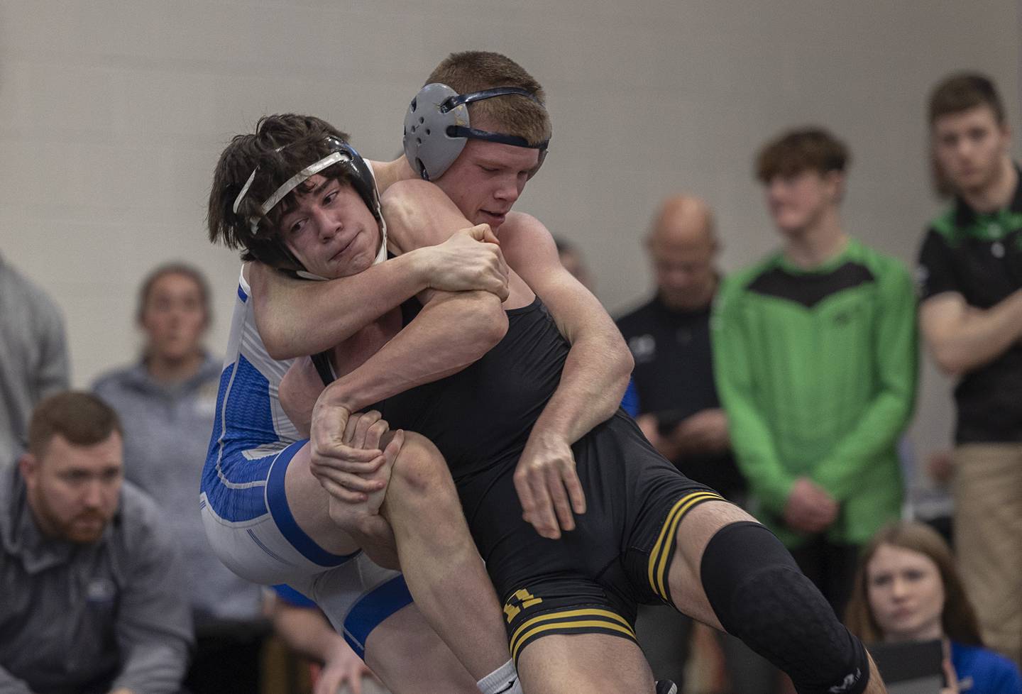 Newman’s Briar Ivey and Riverdale’s Kolton Kruze square off for the title at 138 pounds Saturday, Feb. 3, 2024 during the class 1A Fulton wrestling regionals.