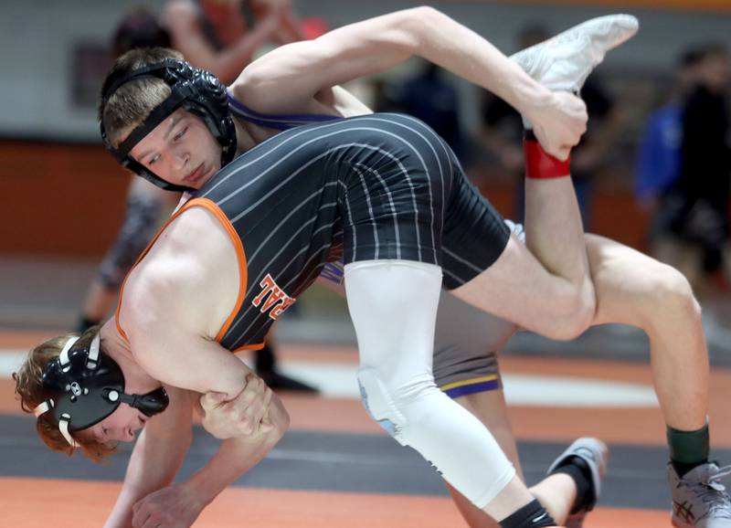 Wauconda’s Lucas Galdine, top, won the title bout over Crystal Lake Central’s Payton Ramsey at 106 pounds during IHSA Class 2A regional wrestling at Crystal Lake Central Saturday.