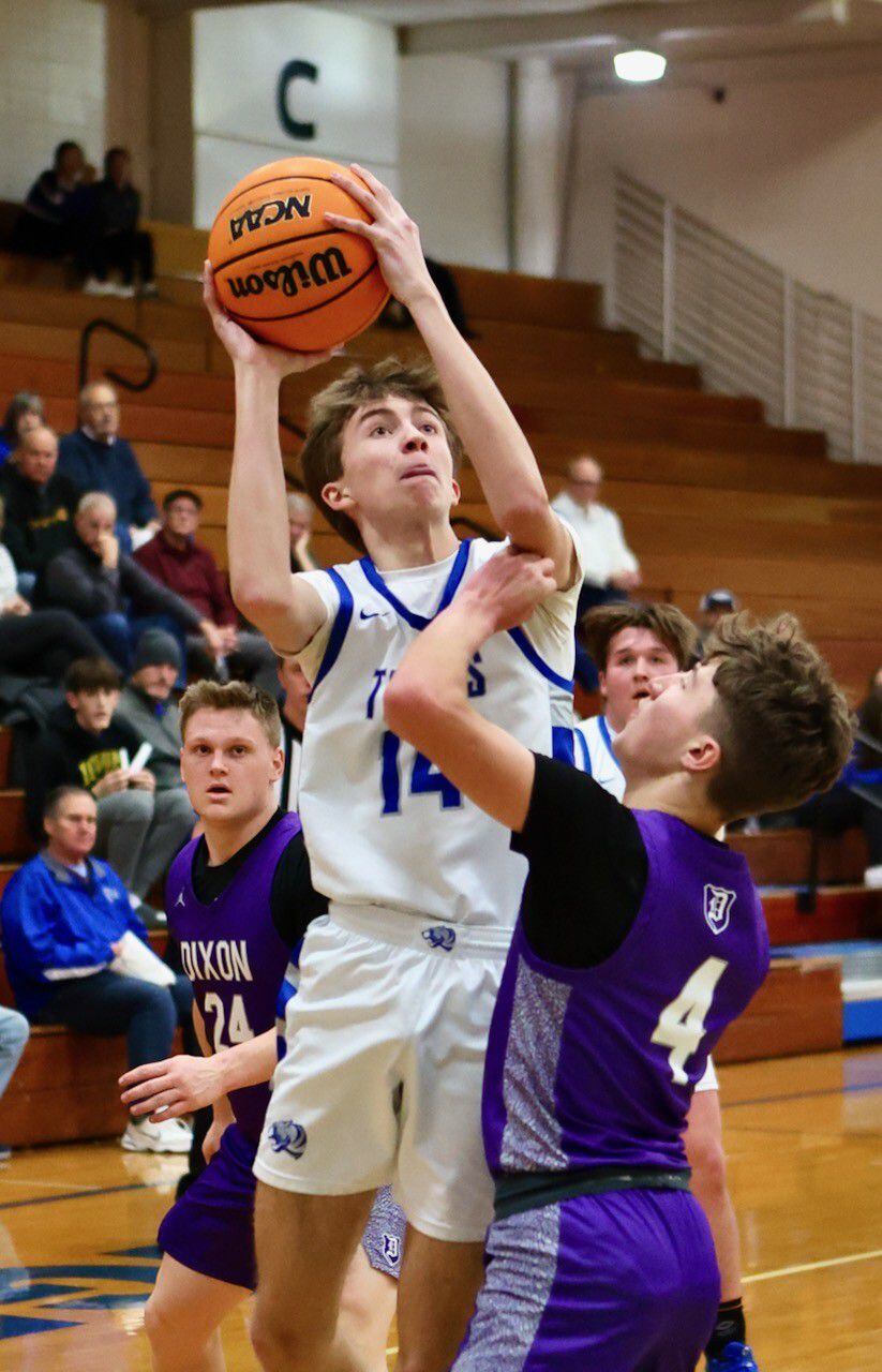 Princeton's Jackson Mason shoots over Dixon's Brody Nicklaus Monday night at Prouty Gym. The Dukes won 61-50.