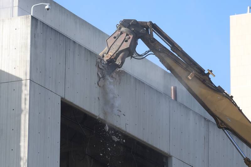 A claw begins working on the external demolition of the old Will County Courthouse on Friday, Feb. 9th 2024 in Joliet.