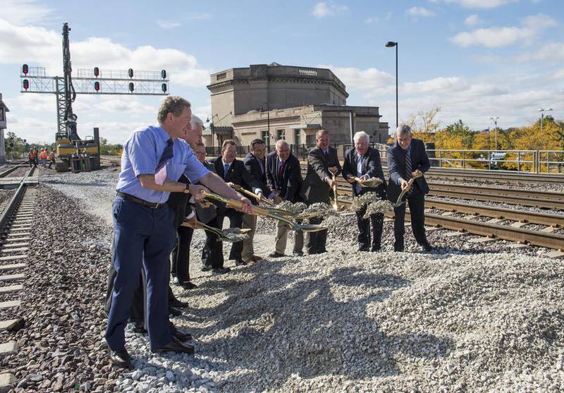 Honored guests shovel some gravel during the ground-breaking ceremony Friday for the Joliet Gateway Center being built downtown.