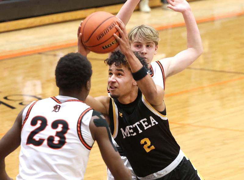 Metea Valley's Dominic Smith tries to get between two DeKalb defenders during their game Friday, Jan. 19, 2024, at DeKalb High School.