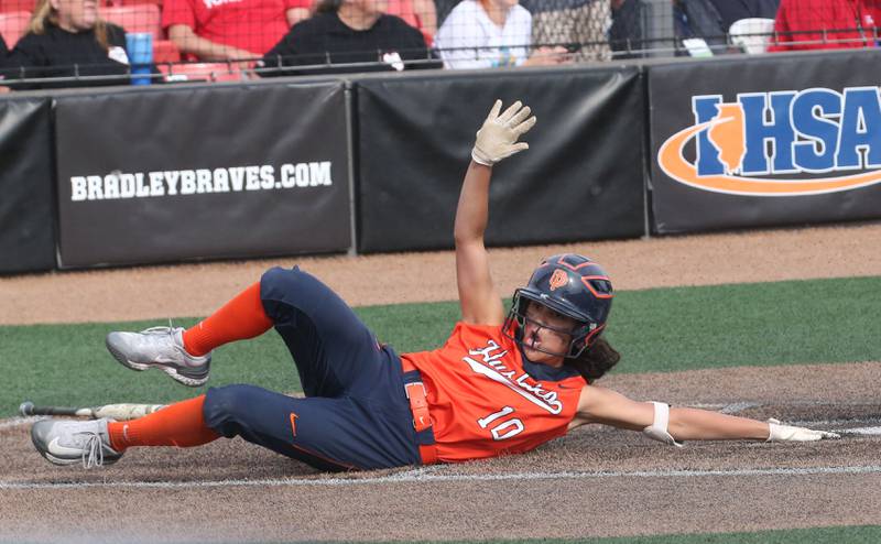 Oak Park-River Forest's Rachel Buchta scores a run against Yorkville during the Class 4A State semifinal softball game on Friday, June 9, 2023 at the Louisville Slugger Sports Complex in Peoria.