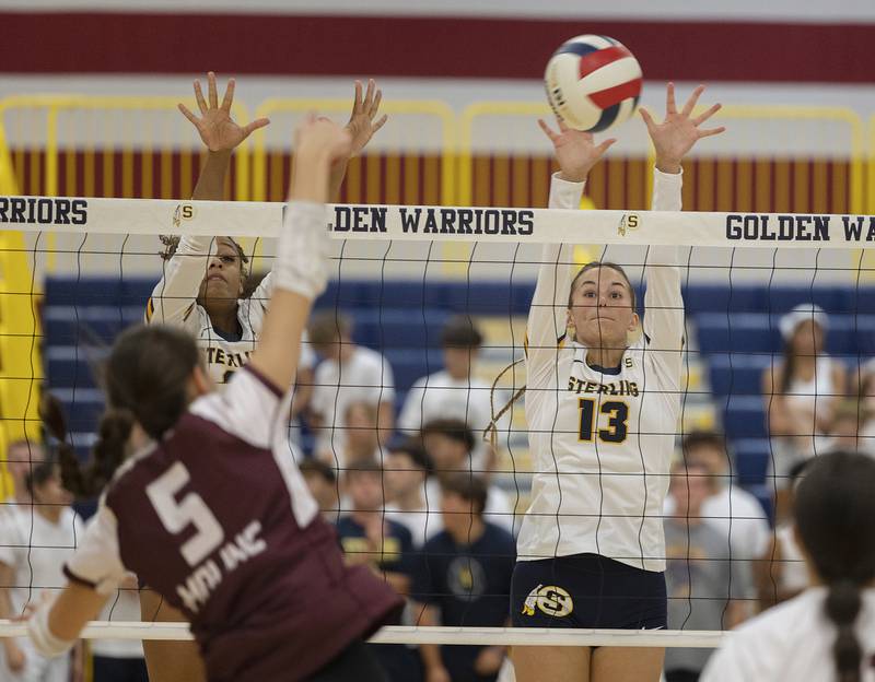 Sterling’s Delali Amankwa (left) and Marley Sechrest work the net Tuesday, Sept. 10, 2024, against Moline.