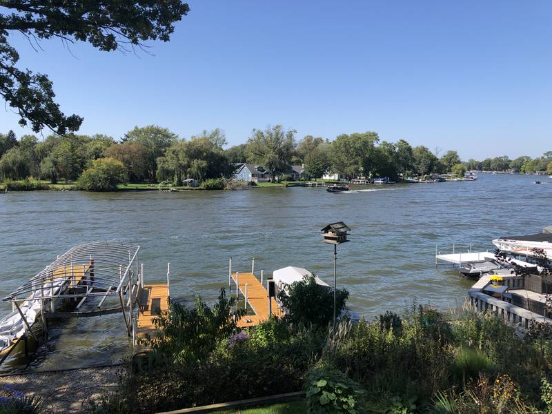 The view from Bob Letmonkski's deck on Mineral Springs Drive, looking across the Fox River on Sunday, Oct. 1, 2023. He and other family members watched Saturday at a boat hit the shore next to the blue house and flipped, killing the two people aboard.