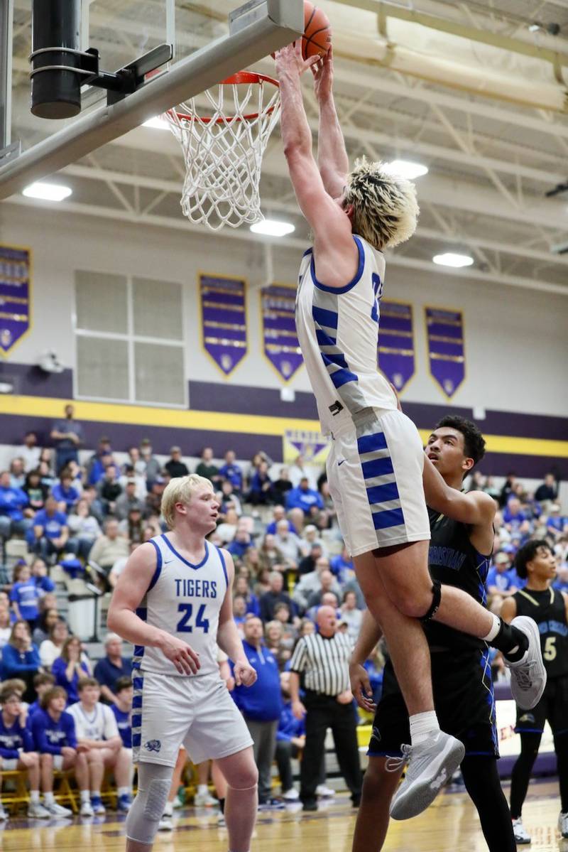 Princeton junior Noah LaPorte throws down a dunk in Tuesday's regional semifinal at Mendota. He scored 28 points to lead the Tigers to a 69-66 win over Rockford Christian.