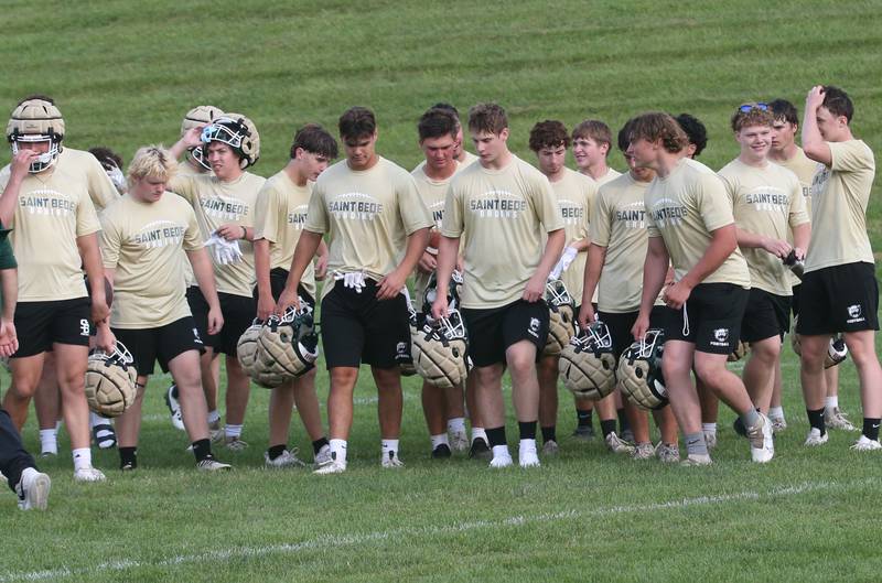 Members of the St. Bede football team walk off of the field after playing Ottawa during  a 7-on-7 meet on Wednesday, July 24, 2024 at Ottawa High School.