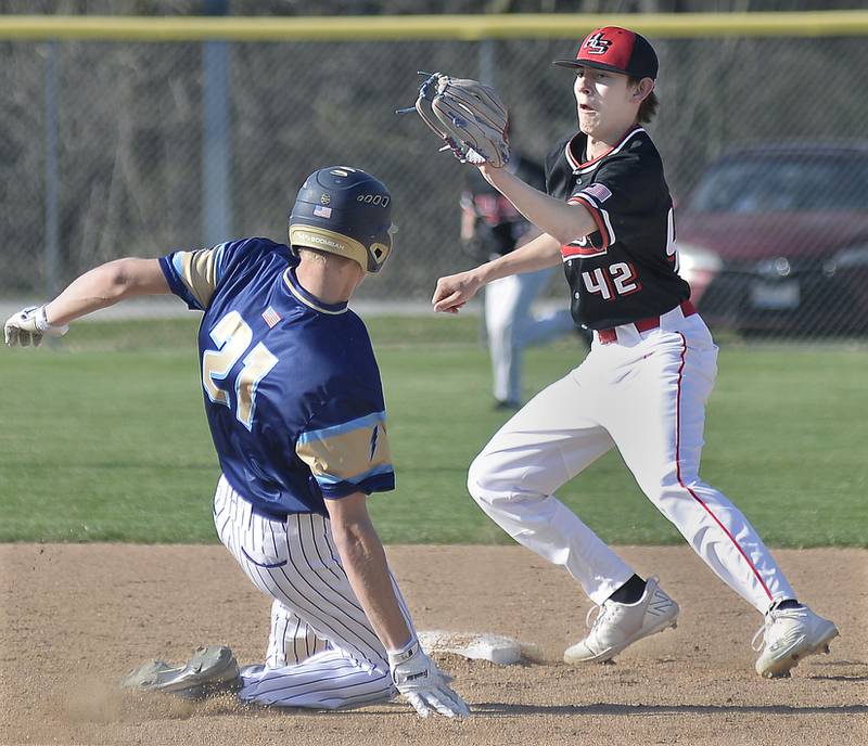 Henry-Senachwine’s Carson Rowe awaits the throw at 2nd base as Marquette’s Charlie Mullen slides into the base in the 3rd inning on Tuesday, April 11, 2023 in Ottawa.