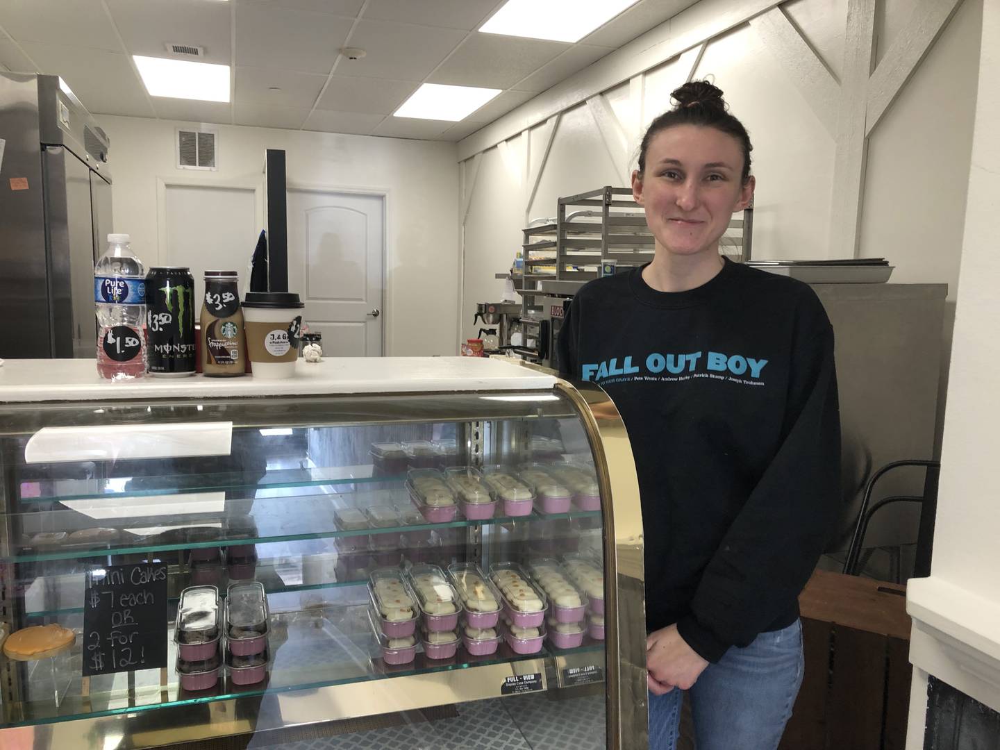 Jessica Cook, owner of J & G Pastries in Woodstock, poses with some freshly-made pastries