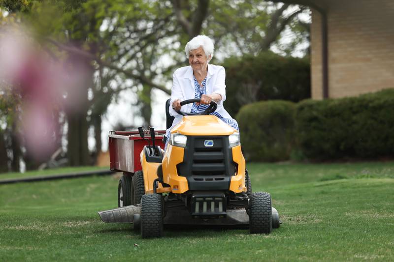 Dolores Spangler, 95 years old, uses her lawn tracker to get around her 1.5 acres at her home in Homer Township.