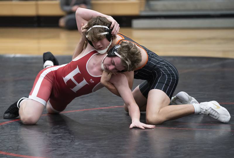 Crystal Lake Central's Cayden Parks wrestles with Huntley's Jack Coleman during the 152 pound bout on Thursday, January 27, 2022 at Huntley High School.