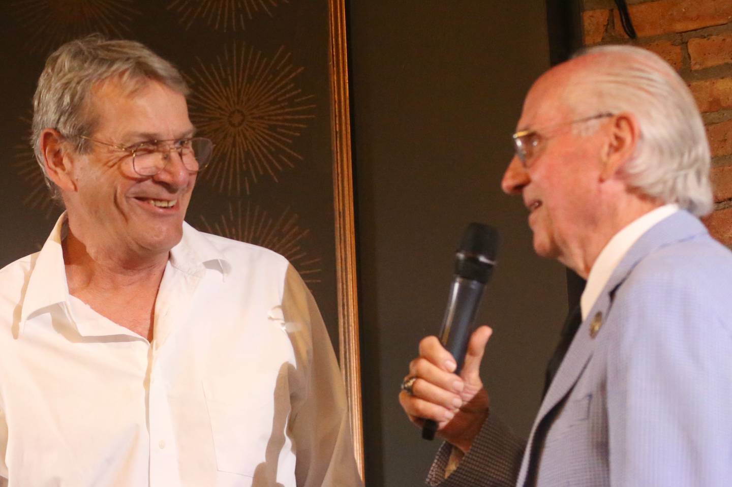 Hollis Vickery speaks with emcee Lanny Slevin during the Illinois Valley Sports Hall of Fame awards banquet on Thursday, June 6, 2024 at the Auditorium Ballroom in La Salle.