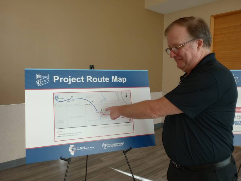 Scott Speegle, passenger rail communications manager for IDOT, points out the project route for the Chicago to Rockford rail service plan at an information session Tuesday, Sept. 17, at The Centre of Elgin, in Elgin. Metra owns the tracks in red on the map and Union Pacific owns the tracks in blue. Most of the improvements will be on the Union Pacific segment, Speegle said.