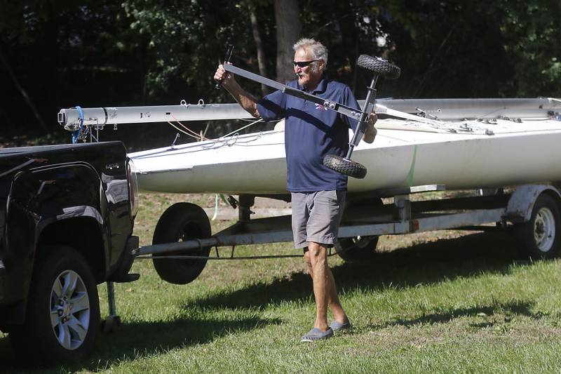 Pistakee Yacht Club member Mark Hoffman loads a valley used to move sailboat trailers into his truck p on Tuesday, Oct. 3, 2023. The yacht club has been parking boats and trailers on a lot next to the club since 1970, with a variance from the county. The Village of Johnsburg says they are in violation and have to move them boats and trailers from the lot.