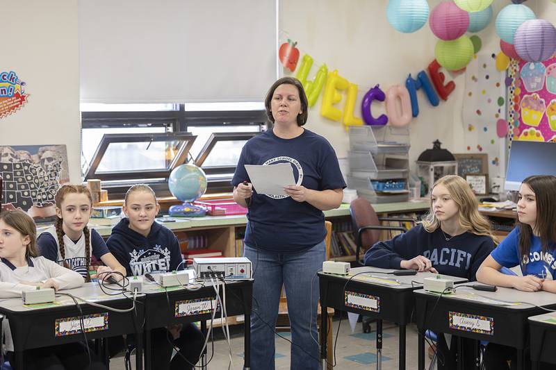 Calli McClain leads a group of Dixon St. Mary’s students in a Scholastic Bowl competition Thursday, Feb. 1, 2024. Local professionals were brought in for fun and education with the students in celebration of Catholic Schools Week.