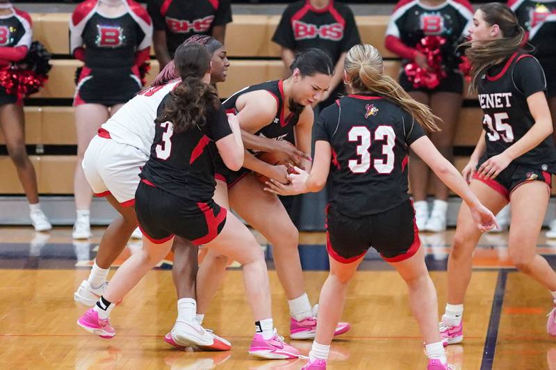 Benet’s Emma Briggs (20) steals the ball from Bolingbrook's Trinity Jones (10) late in the 4th quarter of play during a Oswego sectional 4A basketball game at Oswego High School on Tuesday, Feb 20, 2024.