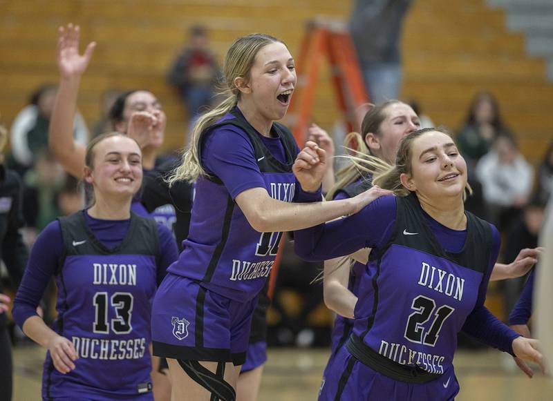 Dixon players celebrate their win over Boylan Friday, Feb. 16, 2024 at the class 3A Rochelle girls basketball regional final.
