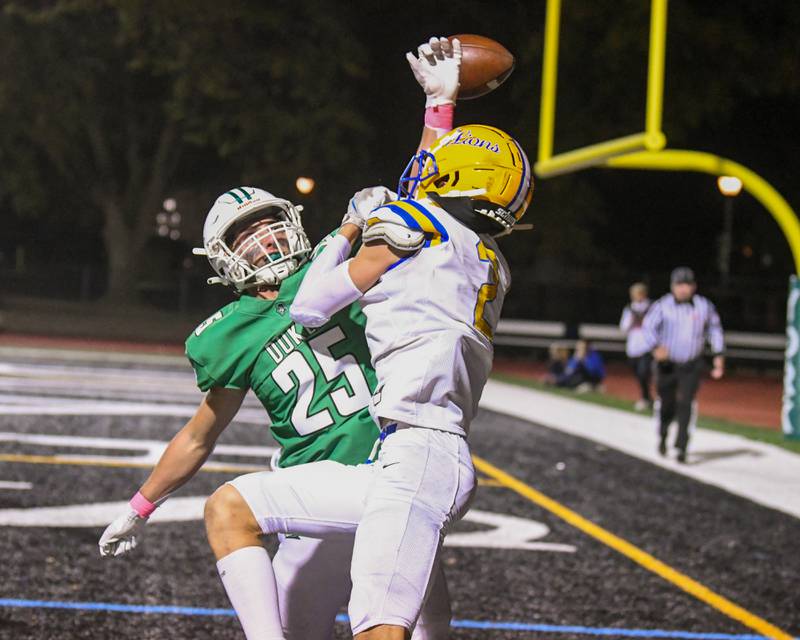 York High School Eddy Sica helps break up a pass to Lyons Township's Travis Stamm (2) during the game on Friday Oct. 18, 2024, held at York High School in Elmhurst.