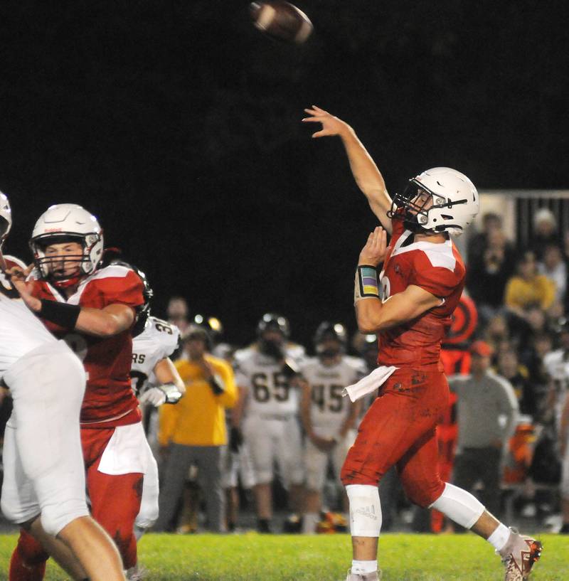 Streator quarterback Christian Benning makes a 50-yard touchdown pass to Matt Williamson in the first quarter of their game against Herscher at Doug Dieken Stadium on Friday, Sept. 22, 2023.