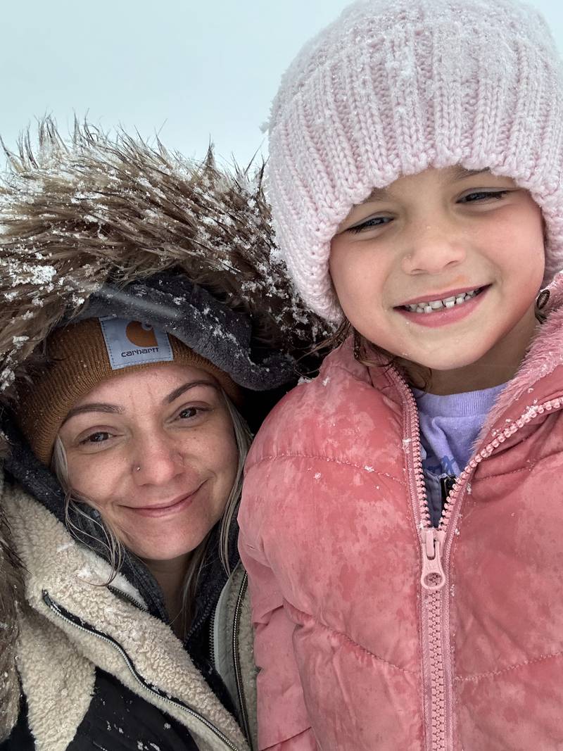 Samantha Crisp and her daughter Olivia, 6, of Lake in the Hills, enjoy the snow on Tuesday, Jan. 9. 2024, in Algonquin.