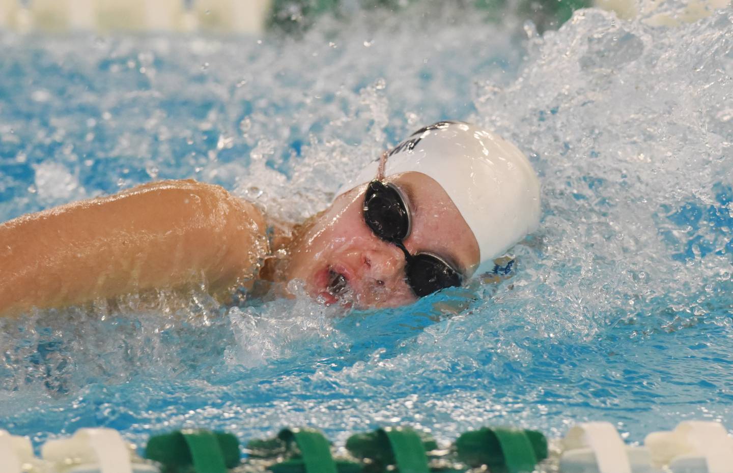 Joe Lewnard/jlewnard@dailyherald.com
Cary-Grove’s Mary Brown swims in the 200-yard freestyle relay during Saturday’s girls swimming meet at Fremd High School in Palatine.