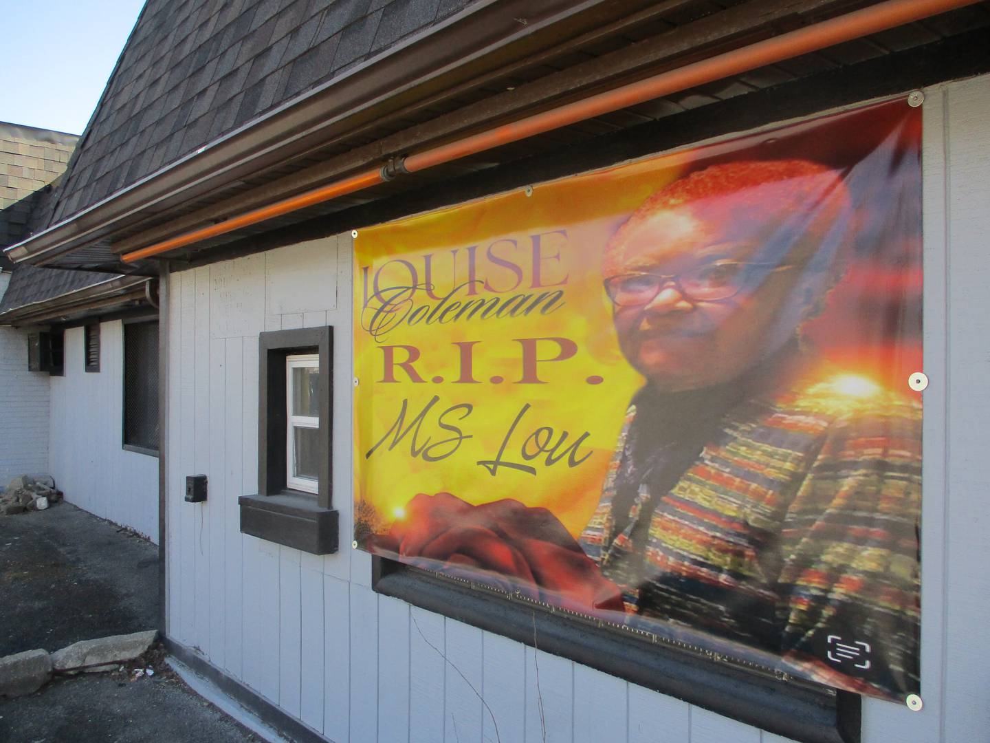 A poster recognizing the passing of Louise Coleman, fondly called Ms. Lou, is on the wall of the Seward's Barbershop, a Joliet business she managed for several decades. Feb. 25, 2024.