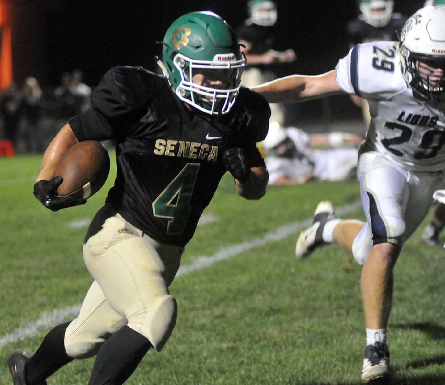 Seneca running back Casey Pifer runs in the Irish's second touchdown Friday as Lisle's Mark McGrath fails to catch him. Pifer also added a touchdown pass in the first half of the 2013 contest.