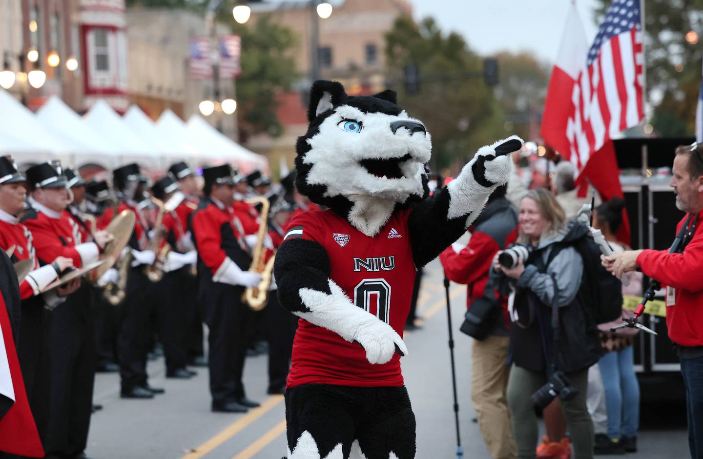 Northern Illinois University mascot Victor E. Huskie fires up attendees during the NIU Huskie Homecoming Block Party Thursday, Oct. 12, 2023, in downtown DeKalb.