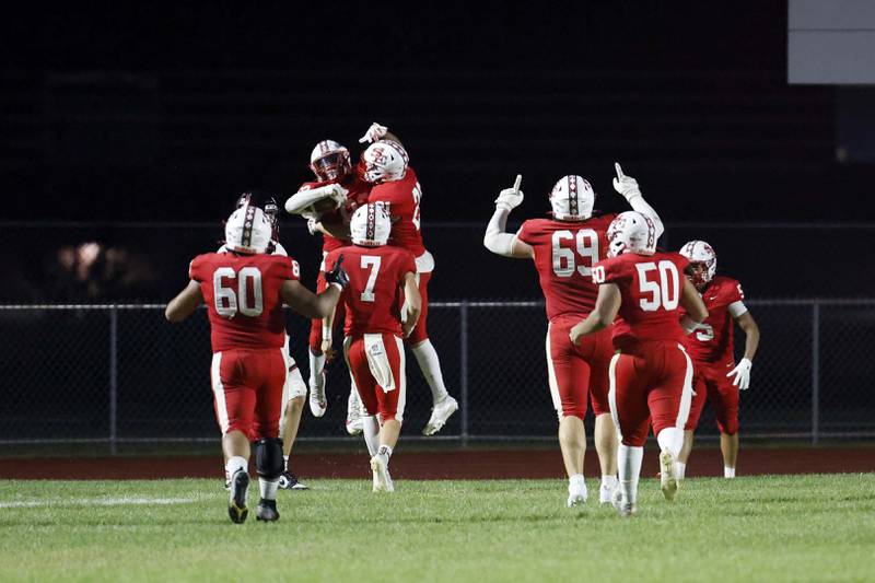 South Elgin's Ishmael George (83) and teammates celebrate a touchdown Friday, Aug. 30, 2024 in South Elgin.